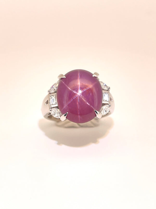 Ring with a purple star-shaped gemstone on a white background Burma Burmese Star Ruby Ring