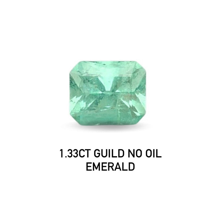 Green emerald gemstone with '1.33CT GUILD NO OIL' text on a white background
