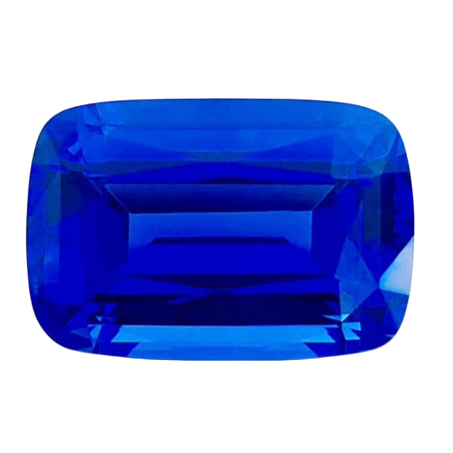 13.87ct tanzanite gemstone with 'Royal Blue' label on a white background